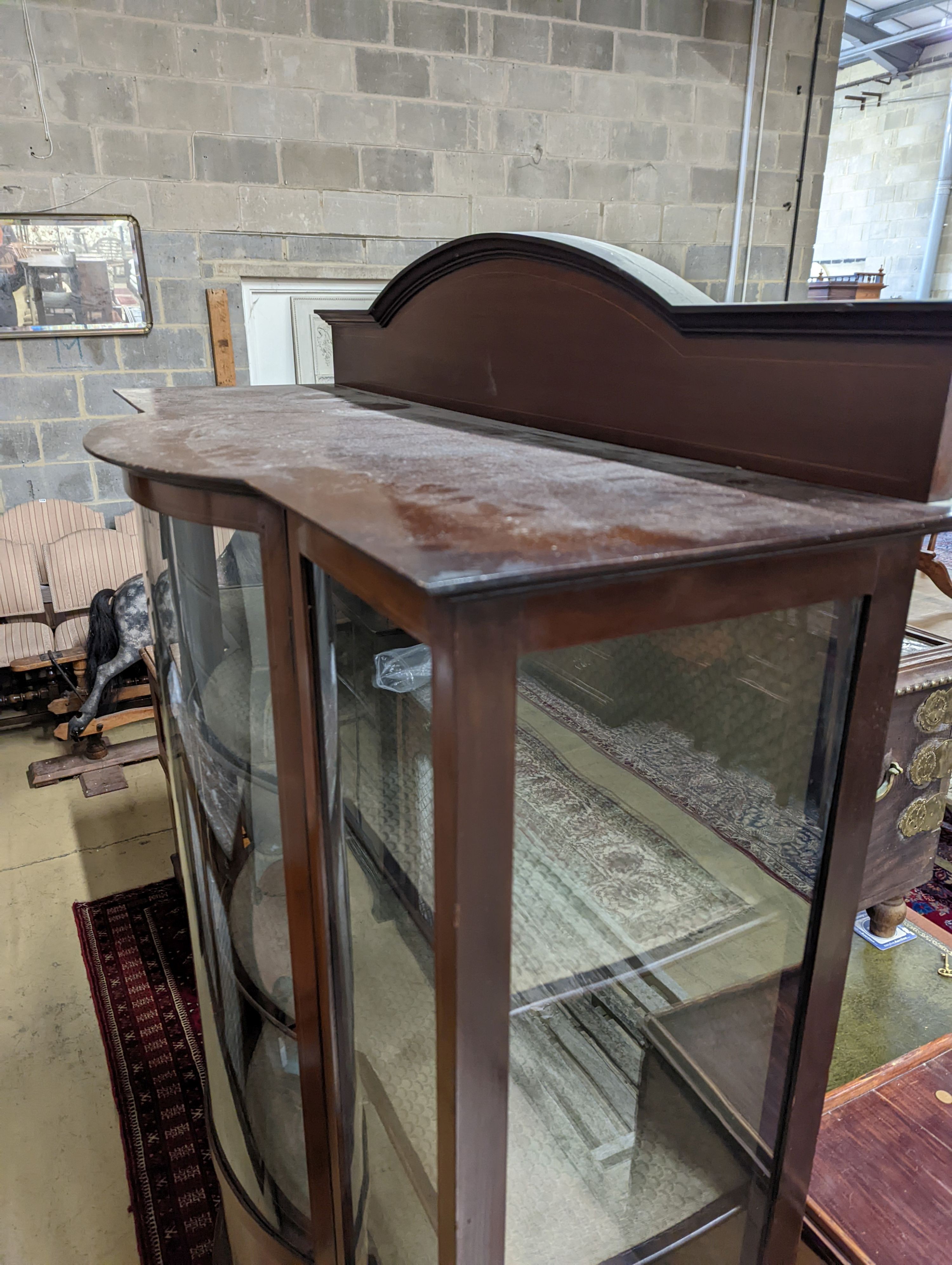 An Edwardian inlaid mahogany bow front display cabinet, width 122cm, depth 48cm, height 196cm
